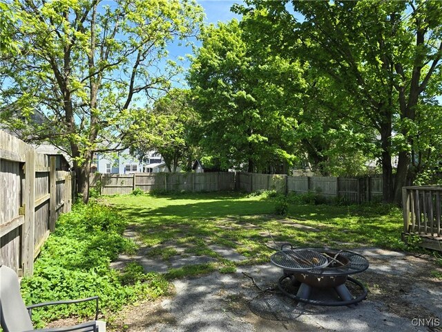 919 Academy St, Watertown-City, NY 13601 - view of yard featuring a fire pit and a patio area