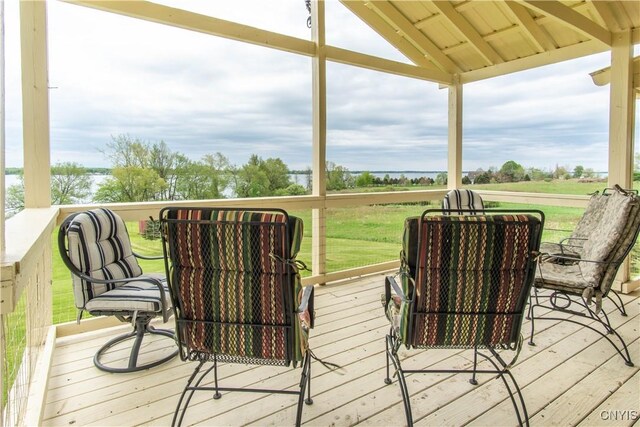 4146 Carleton Island Rd Unit 1, Cape Vincent, NY 13618 - deck with a lawn