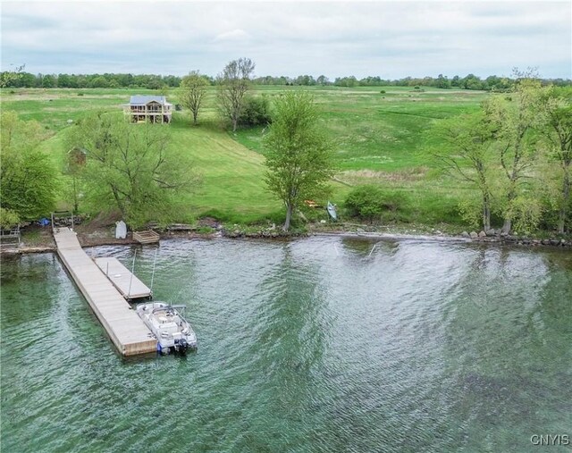 4146 Carleton Island Rd Unit 1, Cape Vincent, NY 13618 - dock featuring a water view and a rural view