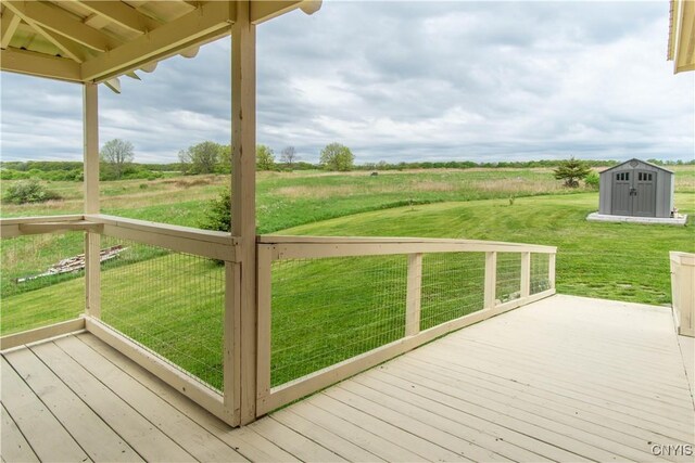 4146 Carleton Island Rd Unit 1, Cape Vincent, NY 13618 - wooden deck featuring a yard and a view of rural / pastoral area