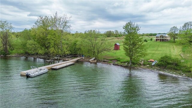 4146 Carleton Island Rd Unit 1, Cape Vincent, NY 13618 - dock with a water view and a lawn