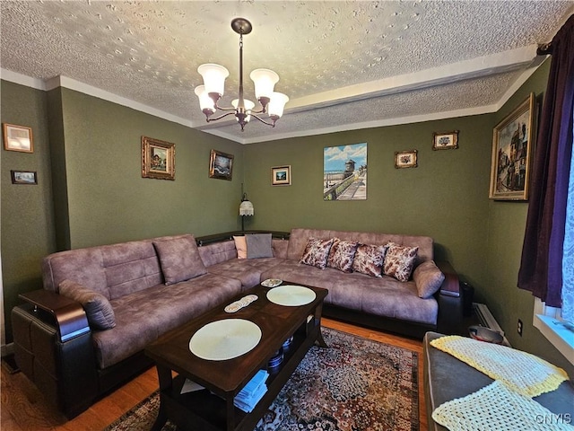 1202 Mary St, Utica, NY 13501 - living room with wood finished floors, a textured ceiling, a chandelier, and ornamental molding