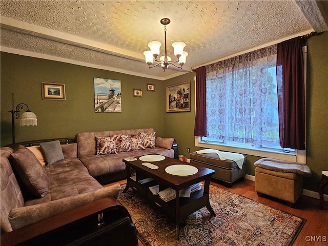 1202 Mary St, Utica, NY 13501 - living area with a chandelier, wood finished floors, a textured ceiling, and baseboards