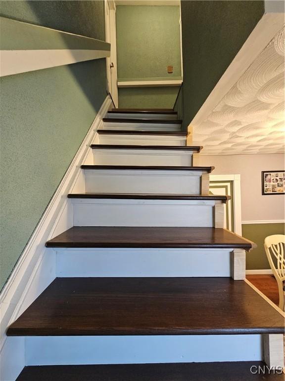 1202 Mary St, Utica, NY 13501 - stairway featuring baseboards