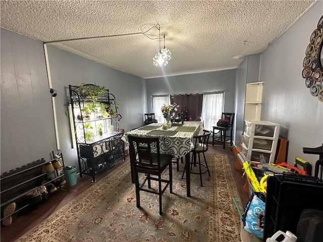 104 Newcomb St, Rochester, NY 14609 - dining room with wood finished floors and a textured ceiling