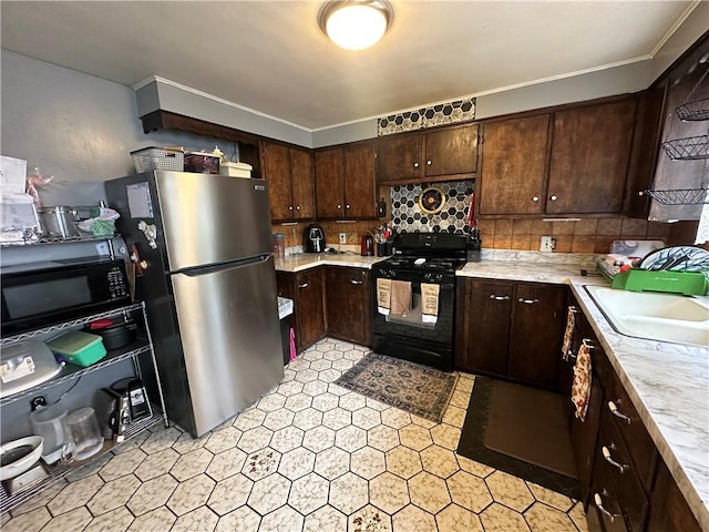 104 Newcomb St, Rochester, NY 14609 - kitchen featuring black appliances, light countertops, dark brown cabinets, and crown molding