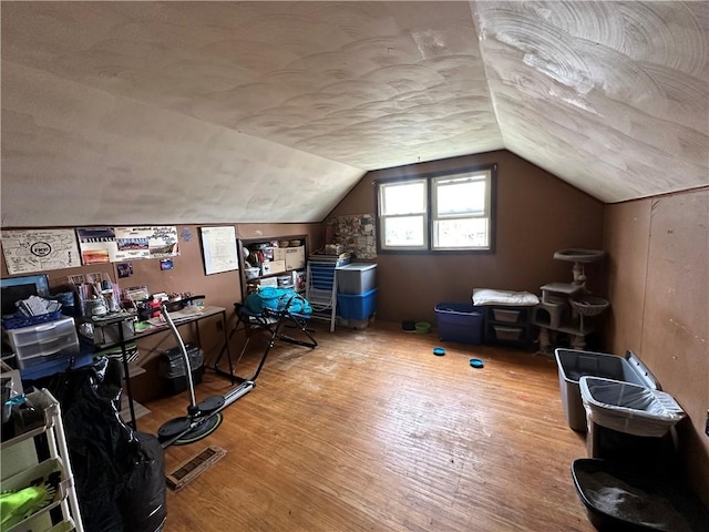 104 Newcomb St, Rochester, NY 14609 - additional living space with wood finished floors and vaulted ceiling