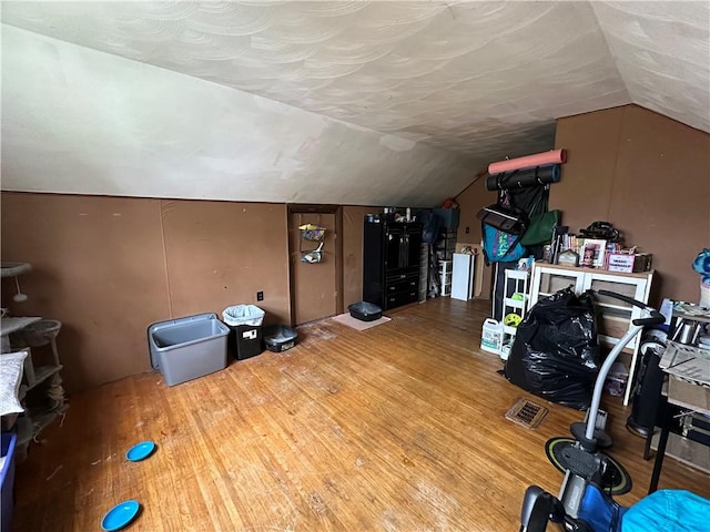 104 Newcomb St, Rochester, NY 14609 - additional living space with lofted ceiling and wood finished floors