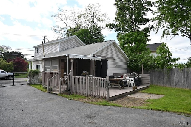 308 State St, Auburn, NY 13021 - view of front of home with a gate, a shingled roof, and a deck