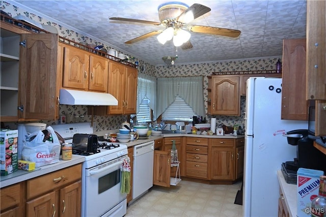 308 State St, Auburn, NY 13021 - kitchen with under cabinet range hood, white appliances, a ceiling fan, brown cabinetry, and light countertops