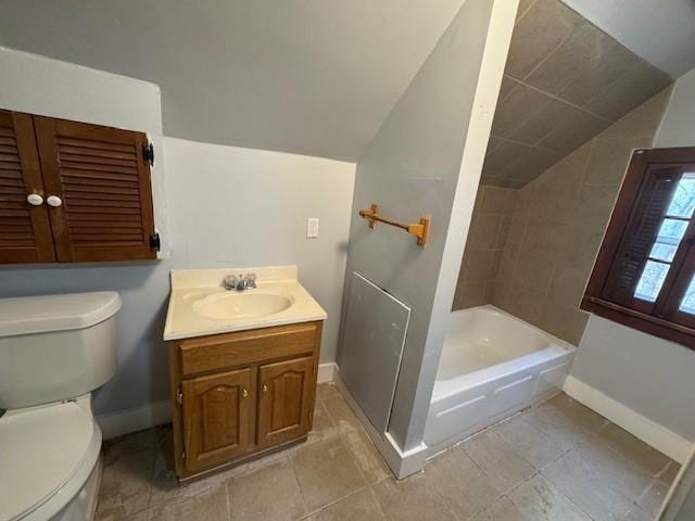 322 Grand Ave, Rochester, NY 14609 - full bath with lofted ceiling, baseboards, toilet, vanity, and tile patterned floors
