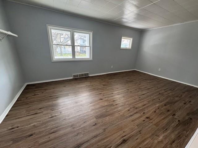 322 Grand Ave, Rochester, NY 14609 - unfurnished room with dark wood-style flooring, baseboards, and ornamental molding