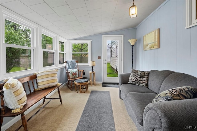 114 E Dauenhauer St, Manlius, NY 13057 - living area featuring healthy amount of natural light, vaulted ceiling, carpet floors, and crown molding