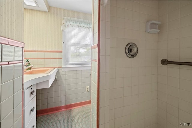 114 E Dauenhauer St, Manlius, NY 13057 - full bathroom with a tile shower, wallpapered walls, tile walls, wainscoting, and vanity