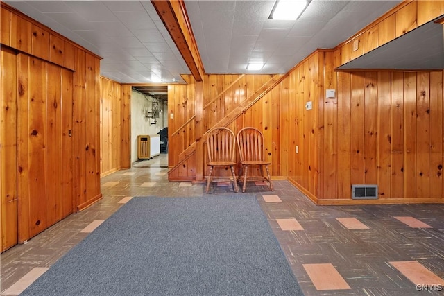 114 E Dauenhauer St, Manlius, NY 13057 - hallway with stairs, wooden walls, radiator heating unit, and baseboards