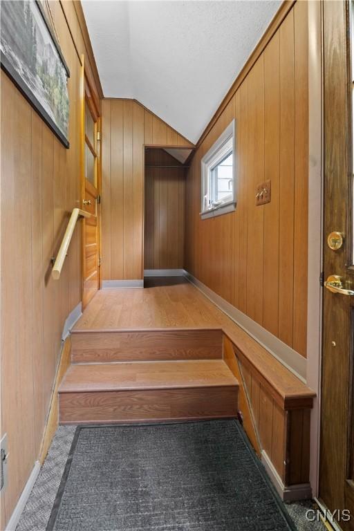 114 E Dauenhauer St, Manlius, NY 13057 - stairs featuring vaulted ceiling and wooden walls