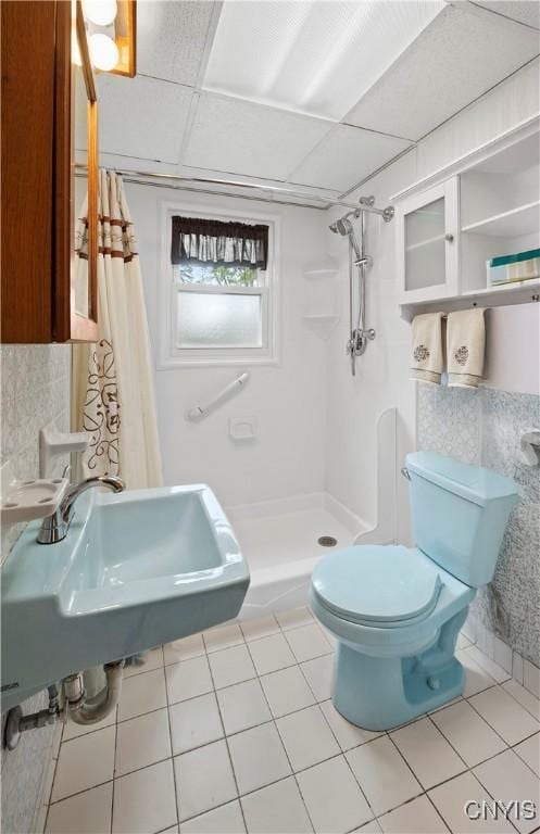 114 E Dauenhauer St, Manlius, NY 13057 - full bathroom featuring a stall shower, toilet, tile patterned floors, a sink, and a drop ceiling