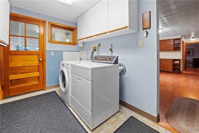 114 E Dauenhauer St, Manlius, NY 13057 - laundry room with independent washer and dryer, cabinet space, and baseboards