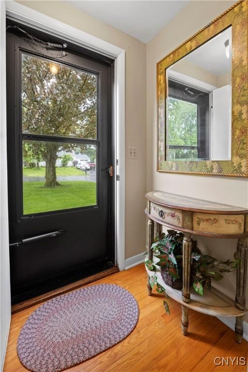 114 E Dauenhauer St, Manlius, NY 13057 - doorway featuring wood finished floors and baseboards