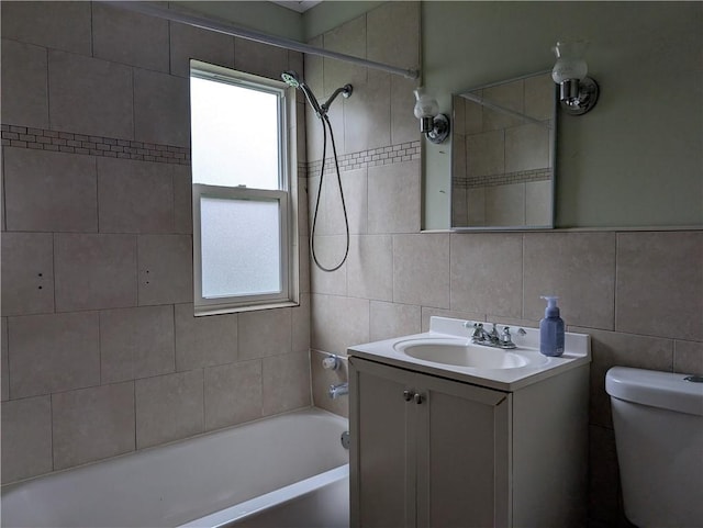 56 Aurora Ave, West Seneca, NY 14224 - bathroom featuring vanity,  shower combination, tile walls, toilet, and tasteful backsplash