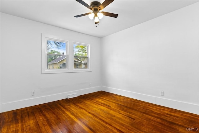 1310 Oak St, Utica, NY 13502 - spare room featuring baseboards, wood finished floors, and ceiling fan
