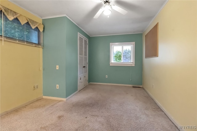 18 Spruce St, Lockport-City, NY 14094 - unfurnished bedroom featuring carpet flooring, a closet, ornamental molding, baseboards, and a ceiling fan