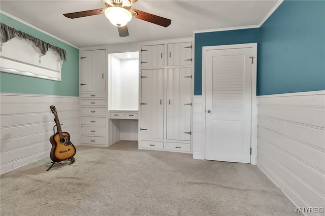 18 Spruce St, Lockport-City, NY 14094 - unfurnished bedroom with carpet floors, wainscoting, a ceiling fan, and ornamental molding