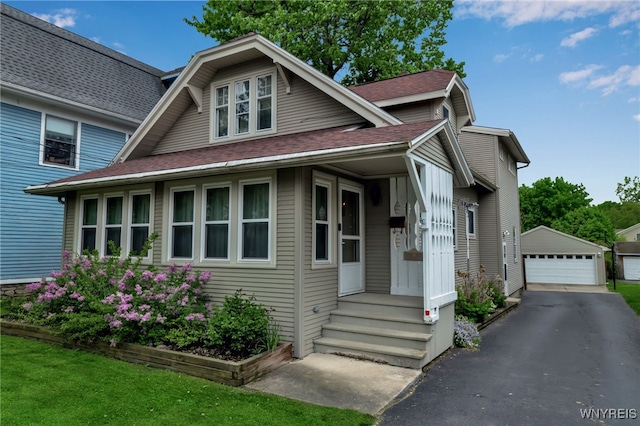 18 Spruce St, Lockport-City, NY 14094 - bungalow with a garage, an outbuilding, and roof with shingles