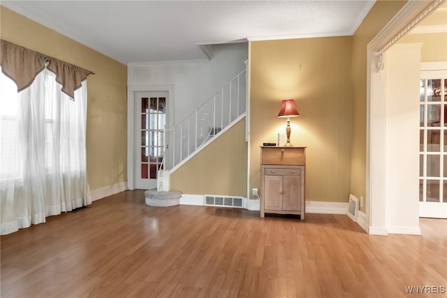 18 Spruce St, Lockport-City, NY 14094 - entrance foyer with ornamental molding, wood finished floors, stairway, and baseboards