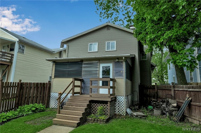 18 Spruce St, Lockport-City, NY 14094 - back of house with a fenced backyard and a deck
