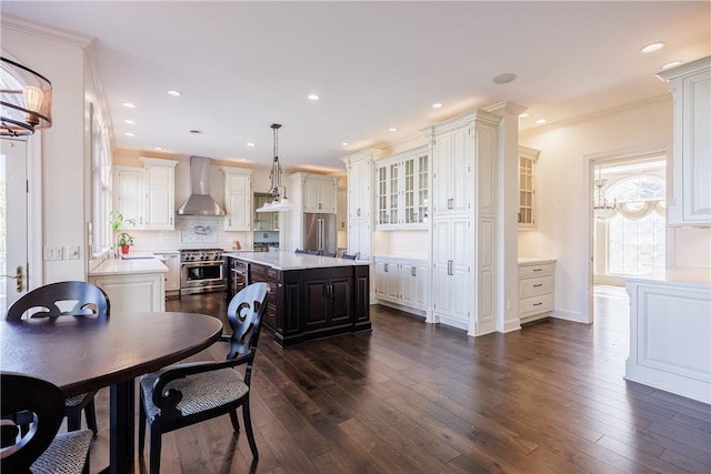 411 Sundance Trl, Webster, NY 14580 - dining area featuring dark wood-style floors, recessed lighting, crown molding, and baseboards