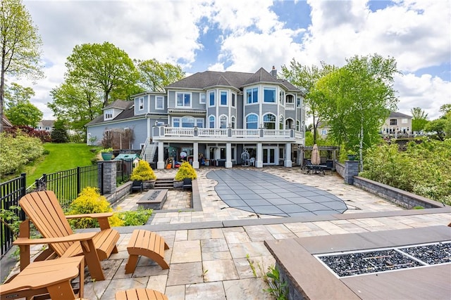 411 Sundance Trl, Webster, NY 14580 - back of property featuring a patio, a chimney, and an outdoor fire pit