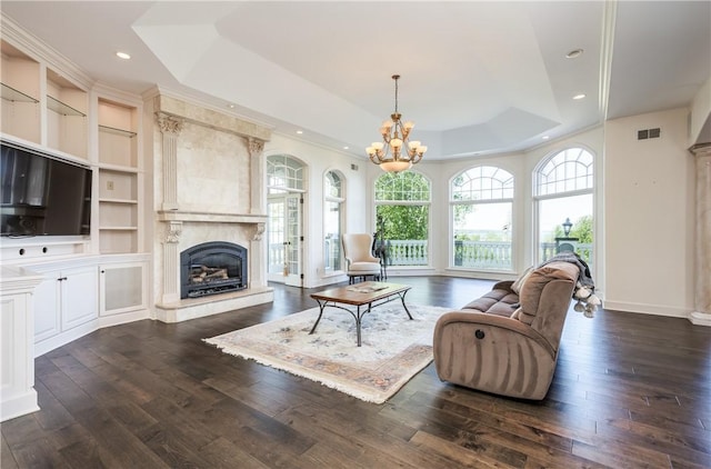 411 Sundance Trl, Webster, NY 14580 - living area with a raised ceiling, a fireplace, a chandelier, dark wood-style floors, and recessed lighting