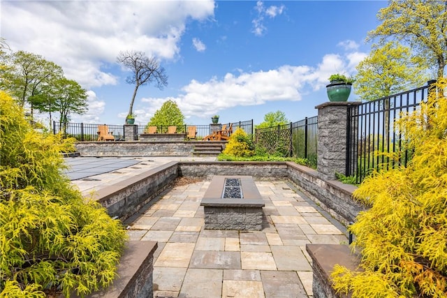 411 Sundance Trl, Webster, NY 14580 - view of patio / terrace with a fire pit