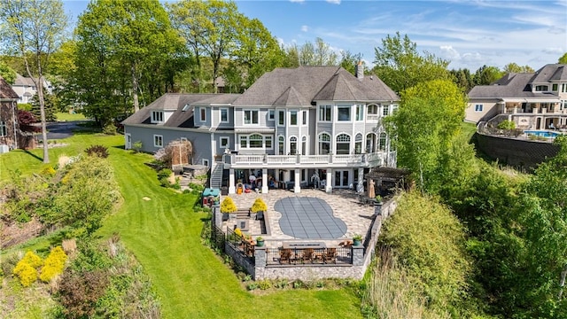 411 Sundance Trl, Webster, NY 14580 - rear view of house featuring a patio area, a wooden deck, and view of wooded area