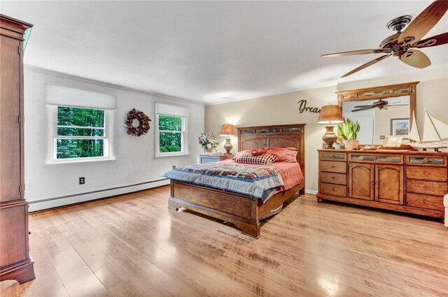 1338 Summit Rd, Foster-Town, PA 16744 - bedroom featuring a baseboard heating unit, light wood-style floors, crown molding, and a ceiling fan