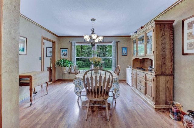 1338 Summit Rd, Foster-Town, PA 16744 - dining room with a chandelier, light wood-style flooring, ornamental molding, and baseboards