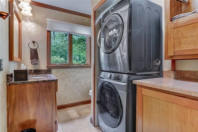 1338 Summit Rd, Foster Town, PA 16744 - laundry room featuring stacked washer and clothes dryer and light tile patterned floors