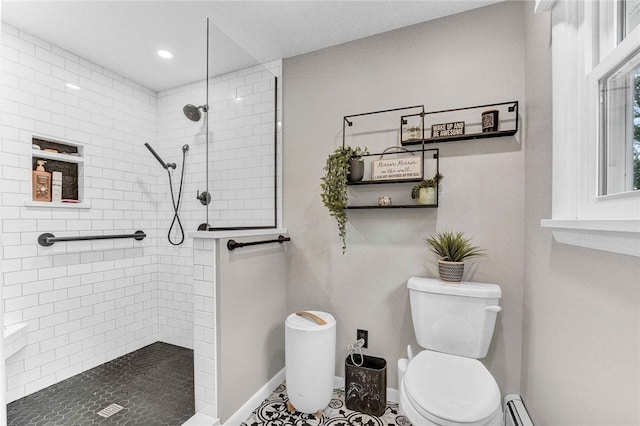 1338 Summit Rd, Foster-Town, PA 16744 - bathroom featuring toilet, tiled shower, baseboards, recessed lighting, and baseboard heating
