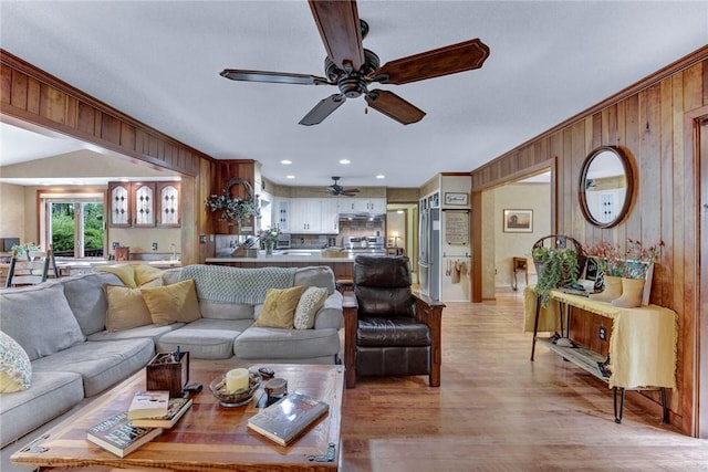 1338 Summit Rd, Foster Town, PA 16744 - living room with ceiling fan, healthy amount of natural light, wooden walls, light wood-style floors, and ornamental molding