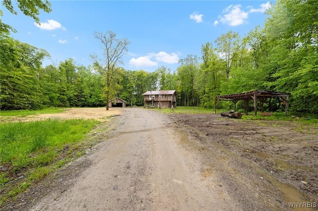12353 Planck Rd, Perrysburg, NY 14129 - view of dirt / gravel road with a wooded view