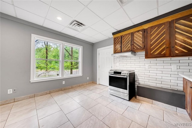 12353 Planck Rd, Perrysburg, NY 14129 - kitchen with stainless steel stove, light countertops, light tile patterned floors, backsplash, and a paneled ceiling