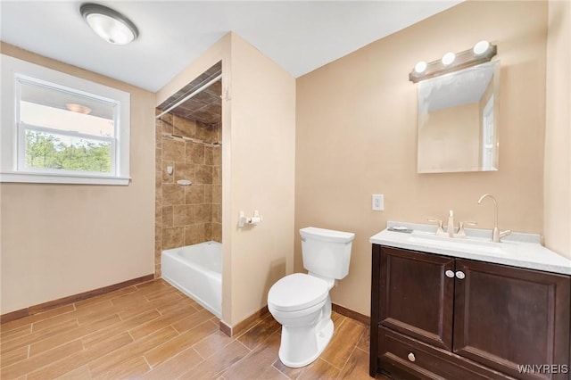 12353 Planck Rd, Perrysburg, NY 14129 - bathroom featuring toilet, baseboards, vanity, wood finished floors, and  shower combination