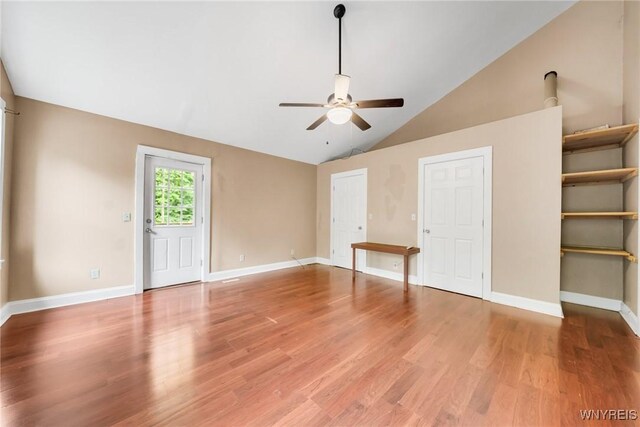 12353 Planck Rd, Perrysburg, NY 14129 - unfurnished living room with ceiling fan, light wood-style flooring, vaulted ceiling, and baseboards