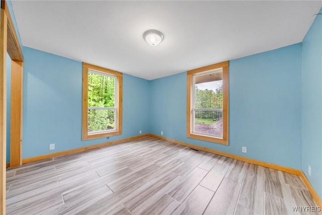 12353 Planck Rd, Perrysburg, NY 14129 - empty room with wood finished floors and baseboards