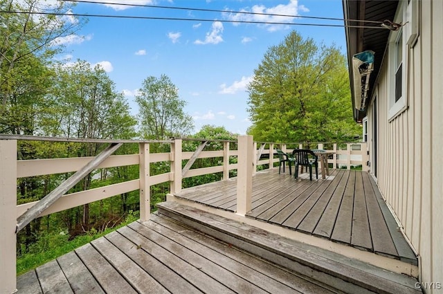 4064 Kayuta Ter, Forestport, NY 13438 - wooden deck featuring outdoor dining area