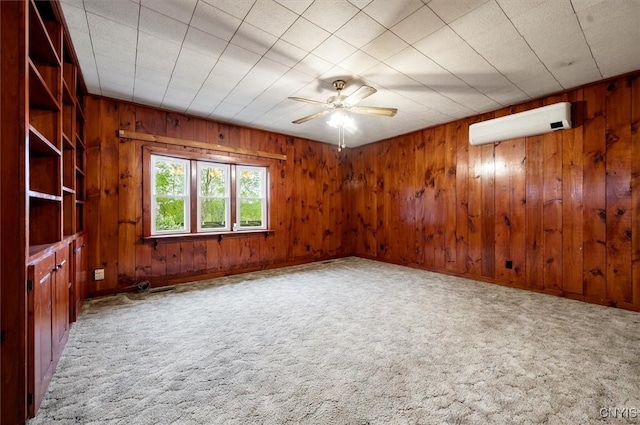 4064 Kayuta Ter, Forestport, NY 13438 - empty room featuring a wall unit AC, carpet flooring, ceiling fan, and wood walls