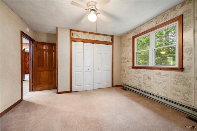 4064 Kayuta Ter, Forestport, NY 13438 - unfurnished bedroom with baseboard heating, multiple windows, light colored carpet, baseboards, and wallpapered walls