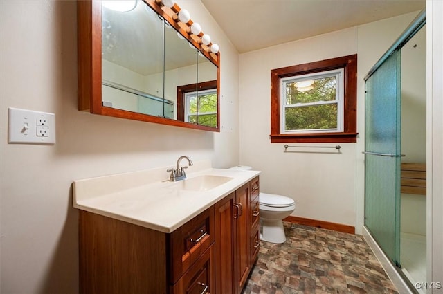 4064 Kayuta Ter, Forestport, NY 13438 - full bathroom featuring stone finish floors, vanity, toilet, a shower stall, and baseboards