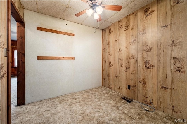4064 Kayuta Ter, Forestport, NY 13438 - spare room with carpet, wood walls, and ceiling fan